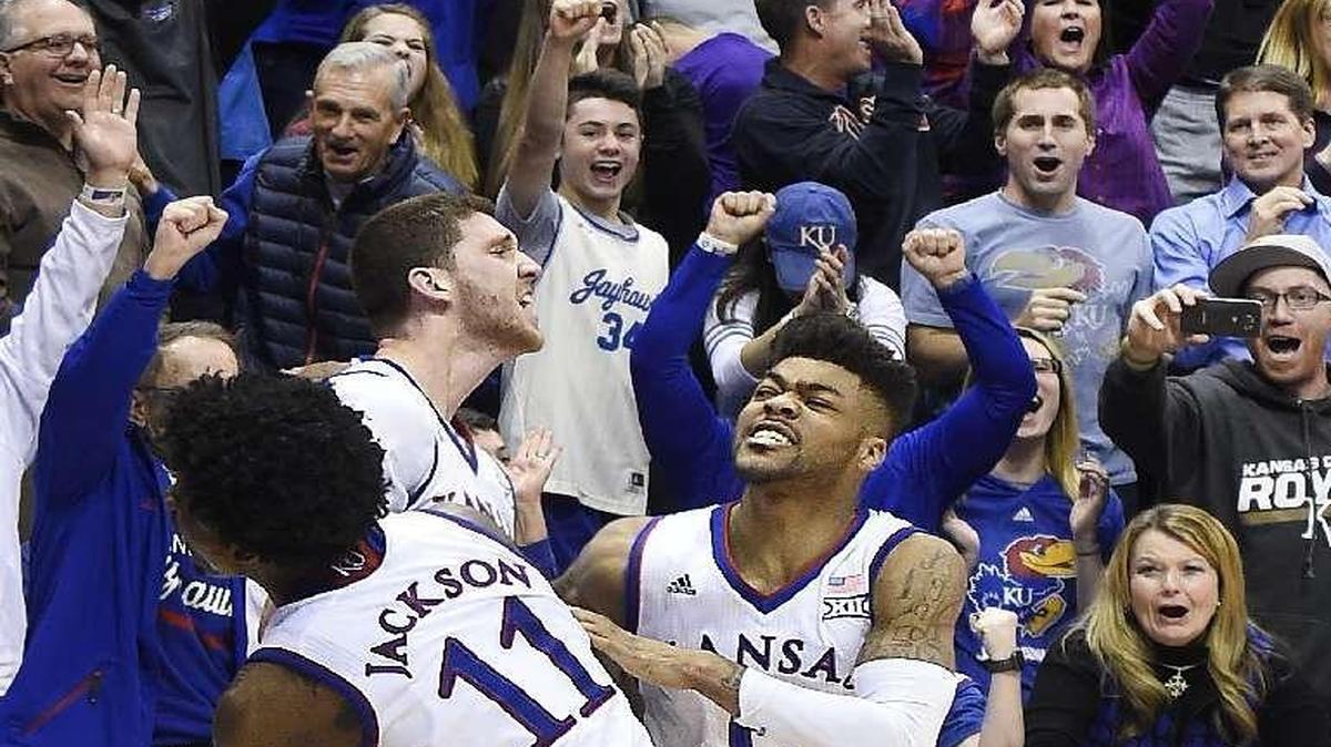 KU’s Svi Mykhailiuk (center) celebrated with his teammates after he hit the game-winning shot Tuesday night in a 90-88 win over Kansas State at Allen Fieldhouse.
