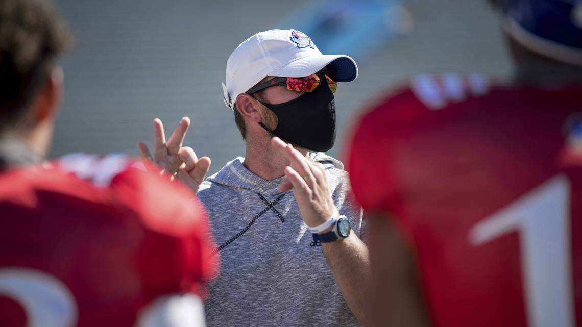 Kansas football offensive coordinator Brent Dearmon instructs his quarterbacks during a 2020 practice.