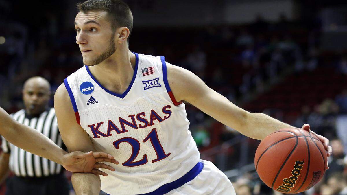 Clay Young, a 6-foot-5 junior from Lansing, is beginning his second season as a non-scholarship Jayhawks basketball player.
