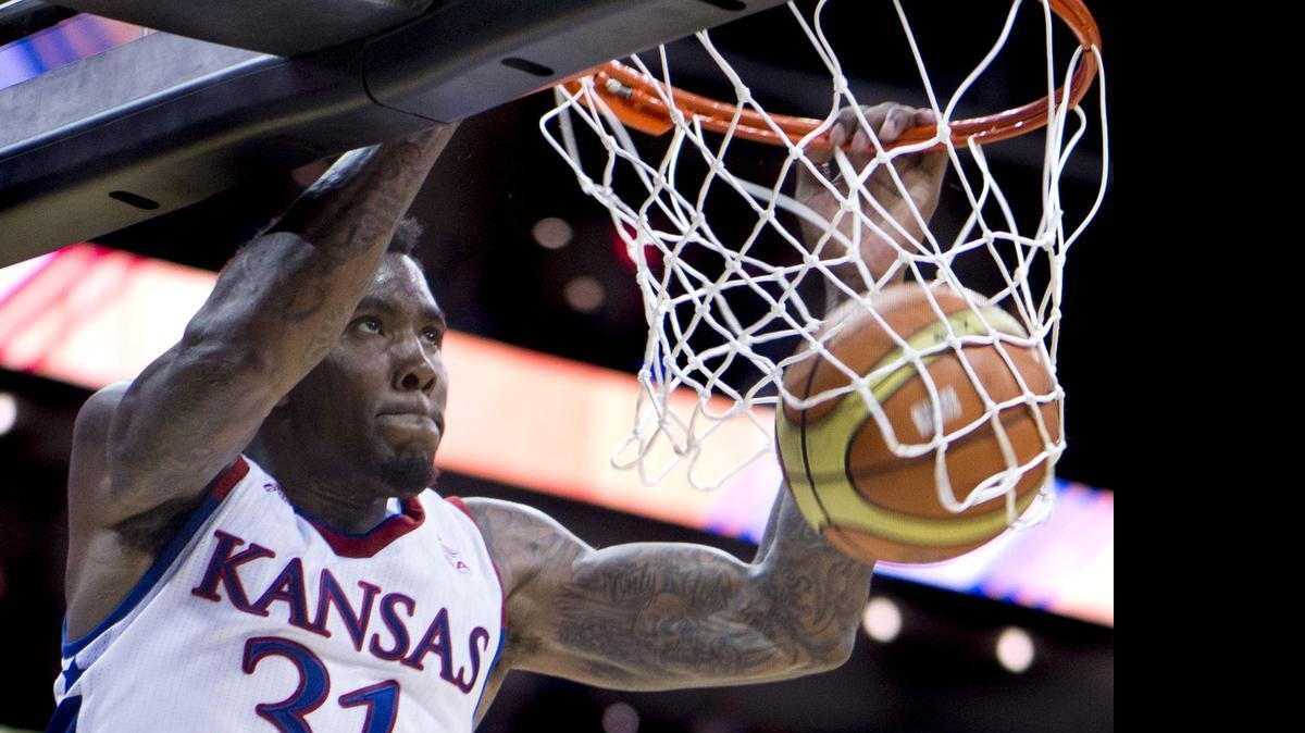 
University of Kansas forward Jamari Traylor (31) dunked the ball during the University of Kansas and Team Canada basketball game at Sprint Center on Friday, June 26, 2015, in Kansas City, Missouri. The Jayhawks beat Canada 87-76.
