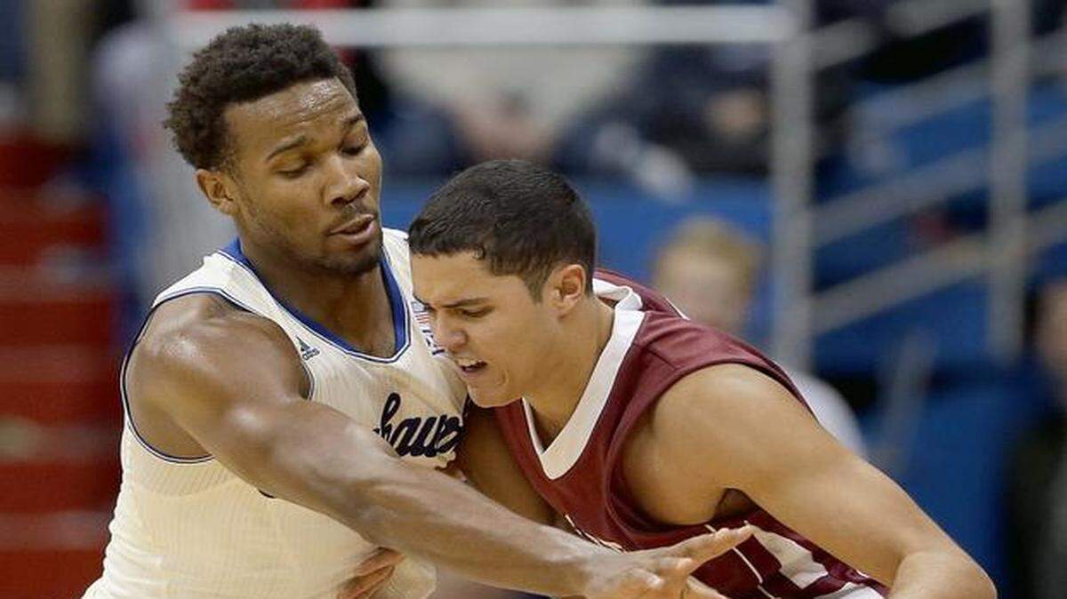 
Kansas’ Wayne Selden Jr. (left) tried to steal the ball from Lafayette’s Monty Boykins in the second half of KU’s 96-69 win Saturday. The Jayhawks remained No. 10 in The Associated Poll released Monday.



