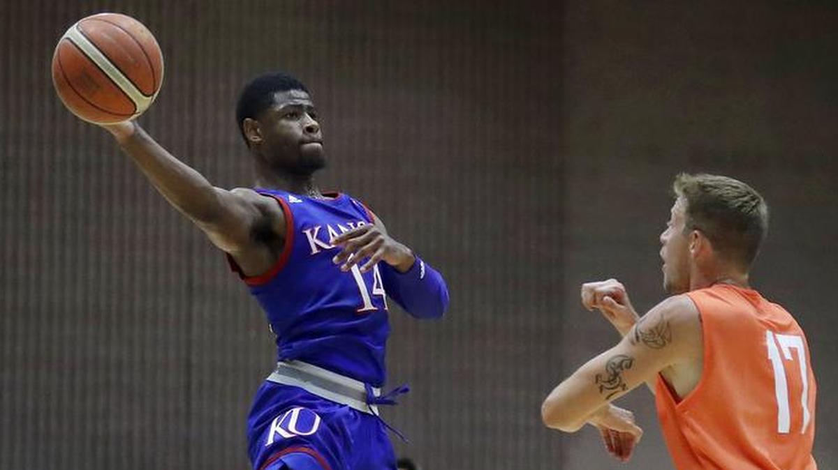 Kansas guard Malik Newman, left, goes to the basket during an exhibition game this summer in Italy.