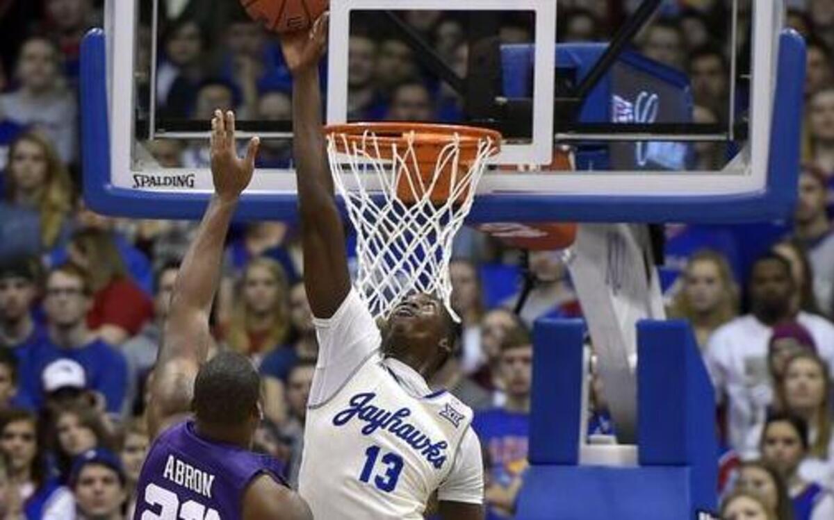 KU’s Cheick Diallo soared above the rim to swat away a shot by TCU’s Devonta Abron during the first half of Saturday’s game at Allen Fieldhouse.