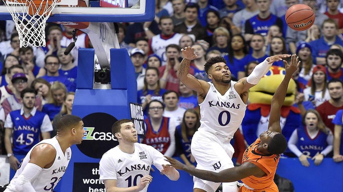 KU's Frank Mason blankets Oklahoma State’s Juwun Evans late during the second half of a game earlier this season at Allen Fieldhouse. KU beat OSU 87-80.