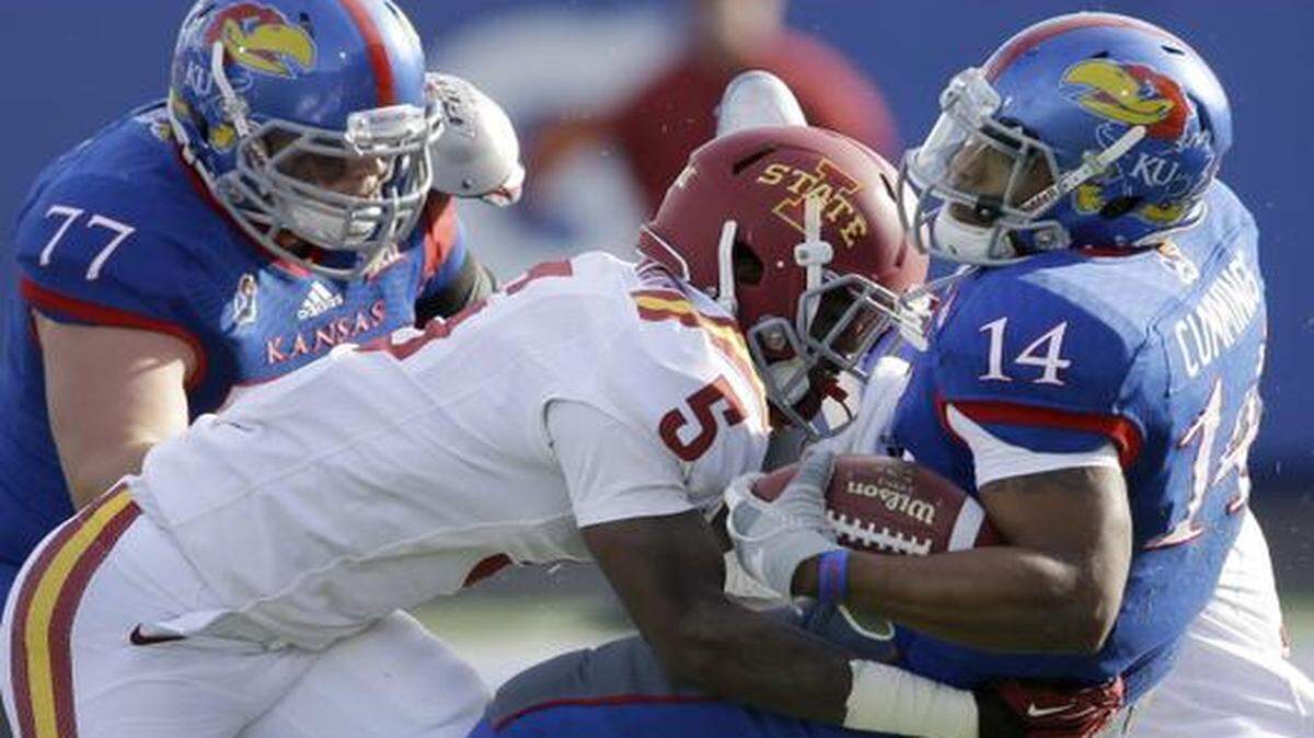
Kansas quarterback Michael Cummings was tackled by Iowa State free stafety Kamari Cotton-Moya in the first half of Saturday’s game.
