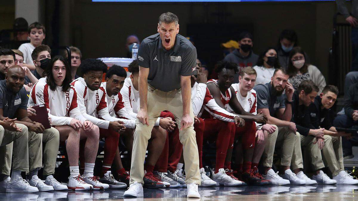 Oklahoma coach Porter Moser reacts during the first half of a game against West Virginia in Morgantown, W.Va., Wednesday, Jan. 26, 2022.