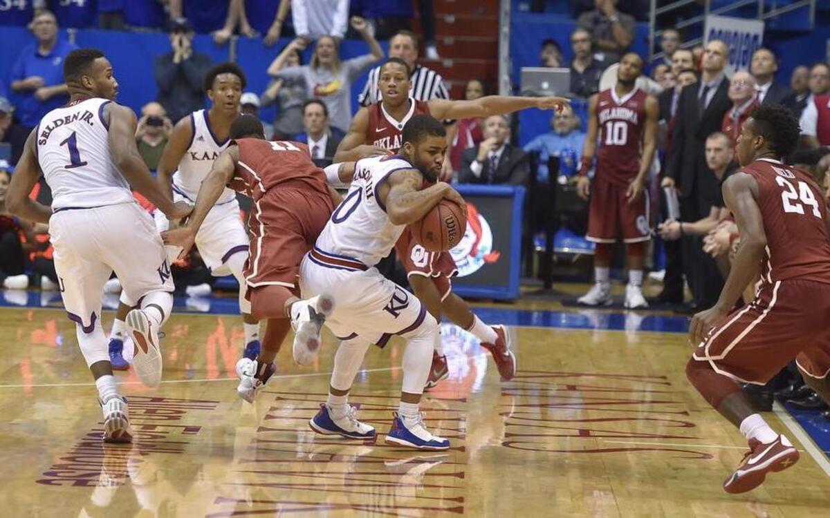 Frank Mason (middle) helped seal KU’s 109-106 triple-overtime win over Oklahoma on Monday night at Allen Fieldhouse.