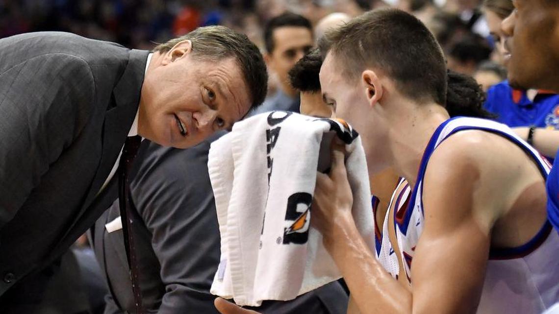 Kansas Jayhawks head coach Bill Self talks with forward Mitch Lightfoot in the second half during the basketball game against the Nebraska-Omaha Mavericks on December 18, 2017, at Allen Fieldhouse in Lawrence, Kan.