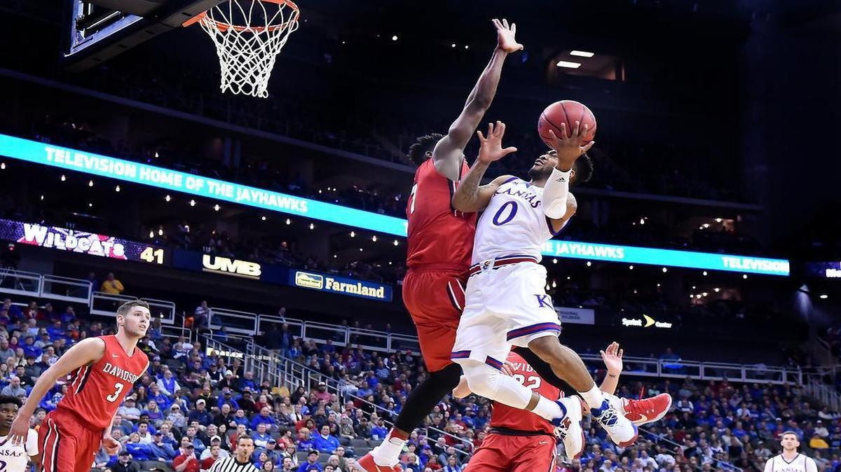 Frank Mason (right) in the game against Davidson on Saturday moved past Mario Chalmers into 28th place on Kansas’ career scoring list.