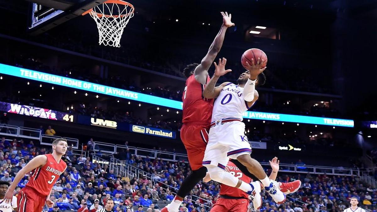 Kansas guard Frank Mason drives on Davidson’s Nathan Ekwu for a shot during the first half Dec. 17 at the Sprint Center. KU beat Davidson 89-71.