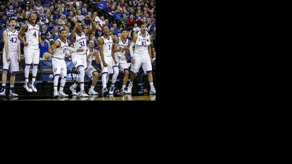 The Kansas Jayhawks starting lineup cheered when backup guard Josh Pollard scored in the final minute of the 75-56 victory over the New Mexico State Aggies during the round of 64 in the NCAA Tournament on March 20 at CenturyLink Center in Omaha, Neb.
