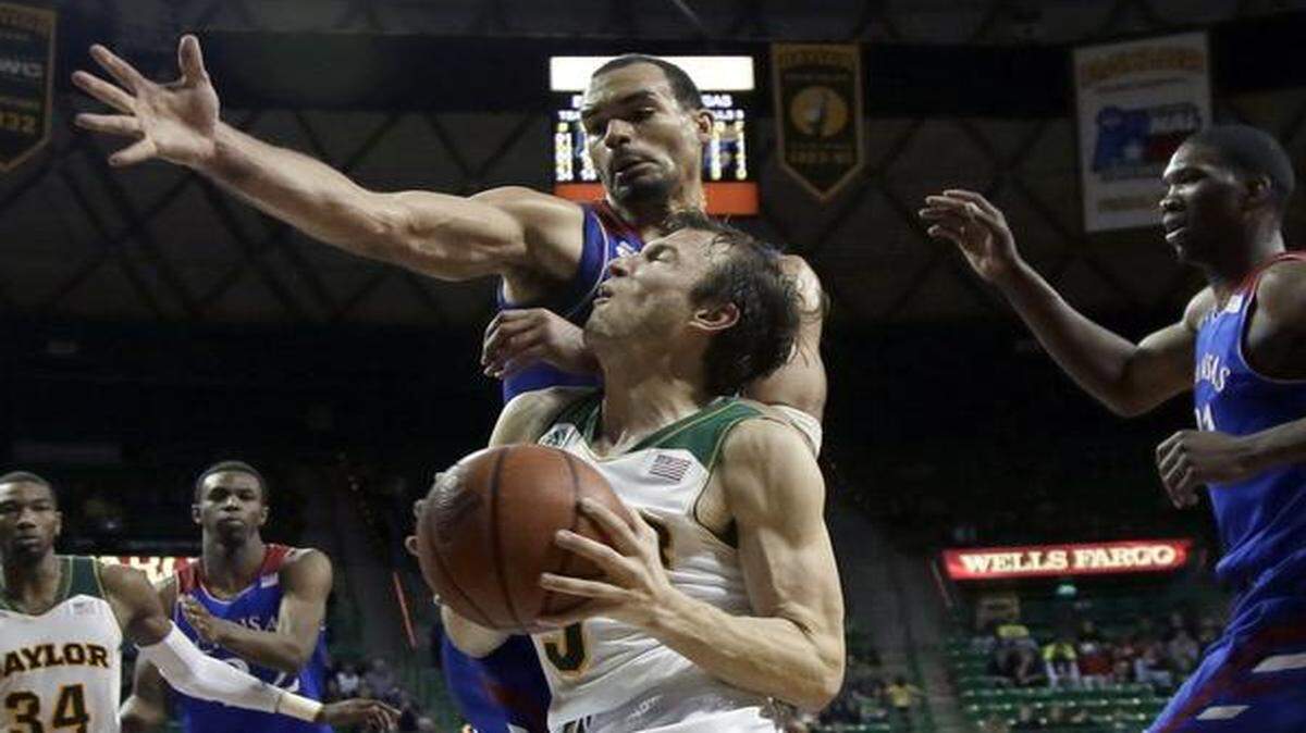 
Baylor guard Brady Heslip was unable to reach the basket for a shot attempt against Kansas’ during a game in February.
