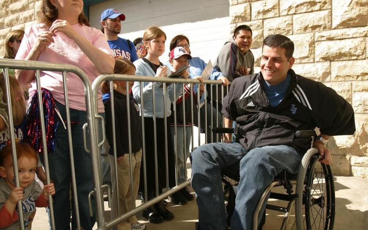 Scott Ward (right) is in charge of academics for KU men’s basketball and women’s volleyball teams.