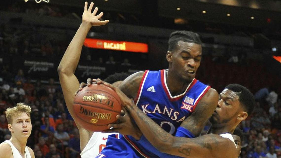 KU’s Lagerald Vick ran into some tough defense on this play against Syracuse on Saturday, but Vick managed to score 20 points in the Jayhawks’ 76-60 victory.