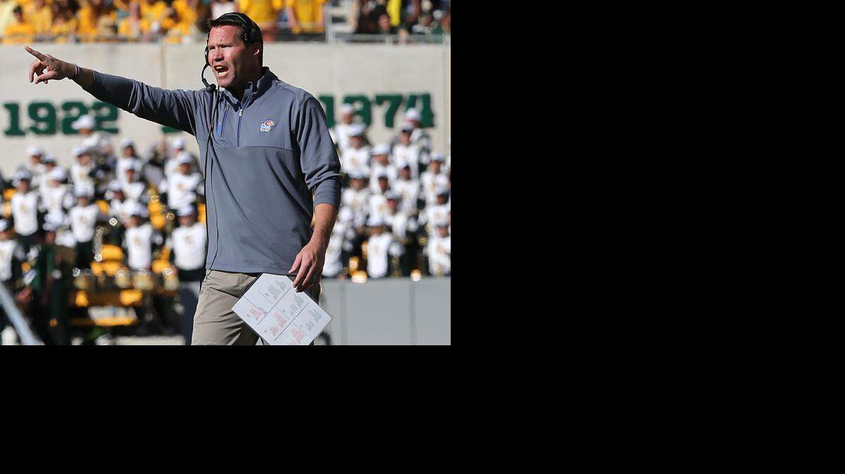 
Kansas interim head coach Clint Bowen shouts to his players in a NCAA college football game against Baylor, Saturday, Nov. 1, 2014, in Waco, Texas. (AP Photo/ Jerry Larson)
