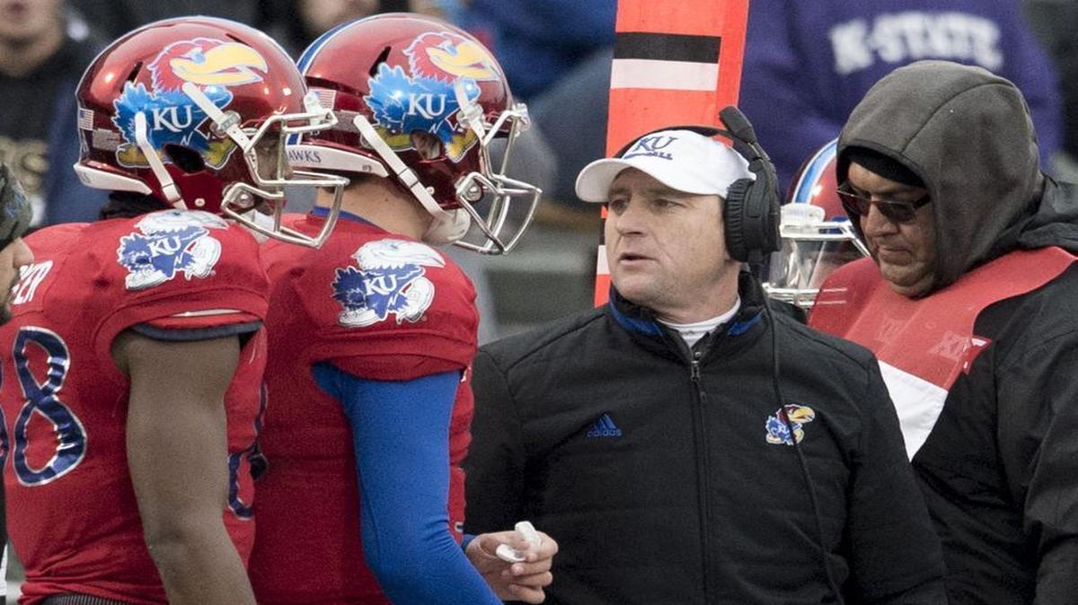 Kansas coach David Beaty (right).