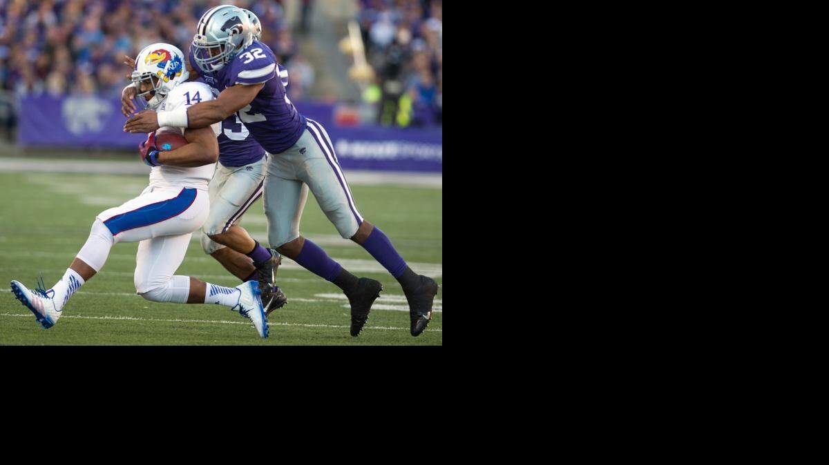 
Kansas quarterback Michael Cummings was run down by Kansas State linebacker Dakorey Johnson in the second quarter on Saturday in Manhattan, Kan.
