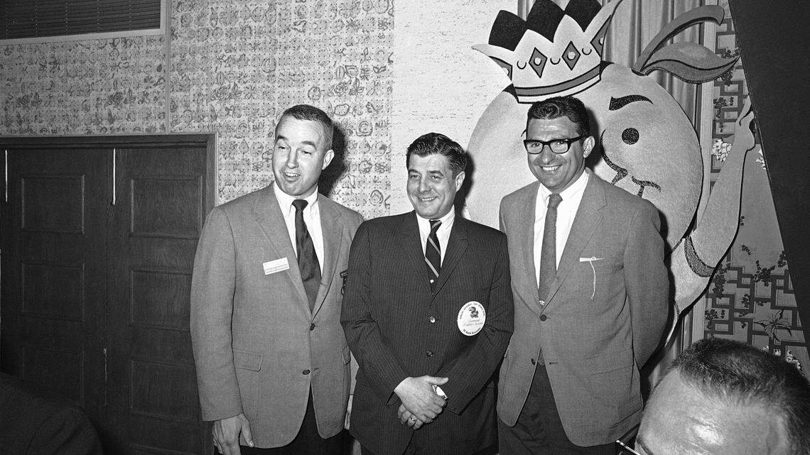 Kansas football coach Pepper Rodgers (left) poses for a photo with Kansas governor Robert Docking, center, and Penn State coach Joe Paterno on Dec. 30, 1968 in Miami ahead of the 1969 Orange Bowl. Rodgers died Thursday at the age of 88.