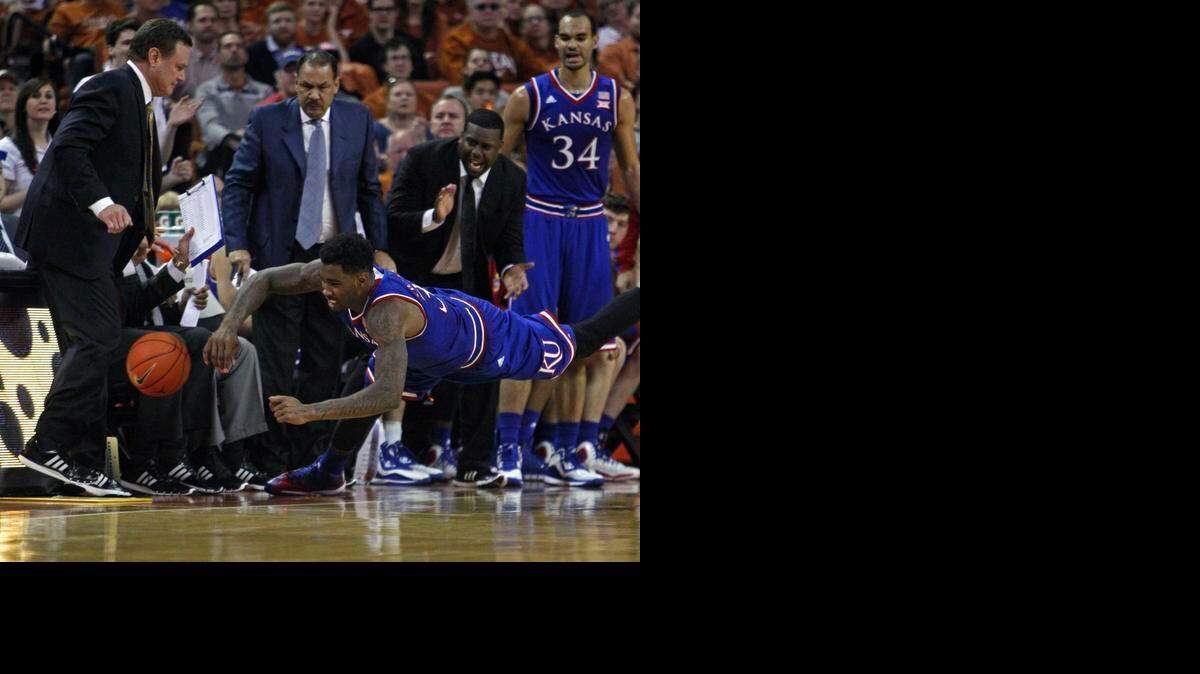 
Kansas’ Jamari Traylor dove for a loose ball during the first half against Texas on Saturday in Austin, Texas. 
