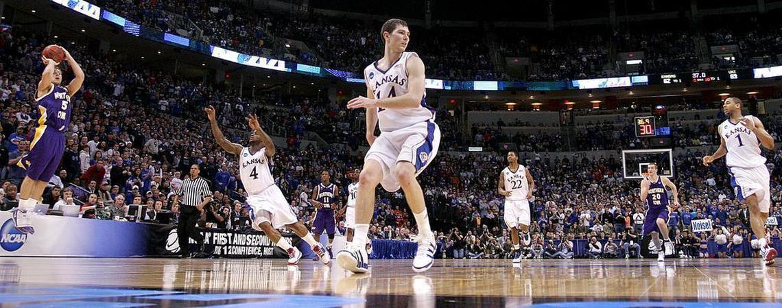 Northern Iowa guard Ali Farokhmanesh (5) was wide open when he popped a three-pointer at near the end of the game as Kansas guard Sherron Collins (4) scrambled to cover him up as Kansas guard Tyrel Reed (14) was looking behind him and Kansas guard Xavier Henry (1) watched. The University of Kansas took on the University of Northern Iowa in the second round of the Midwest Regional NCAA Basketball Tournament at the Ford Center on Saturday, March 20, 2010, in Oklahoma City, Oklahoma.