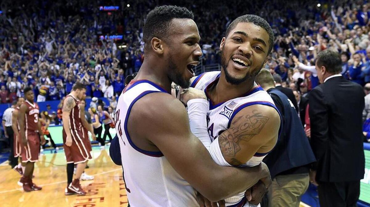 As Kansas coach Bill Self, right, went to shake hands with Oklahoma coach Lon Kruger and the Sooners, KU veterans Wayne Selden, left, and Frank Mason celebrated the Jayhawks’ 109-106 triple-overtime win at Allen Fieldhouse on Jan. 4, 2016.