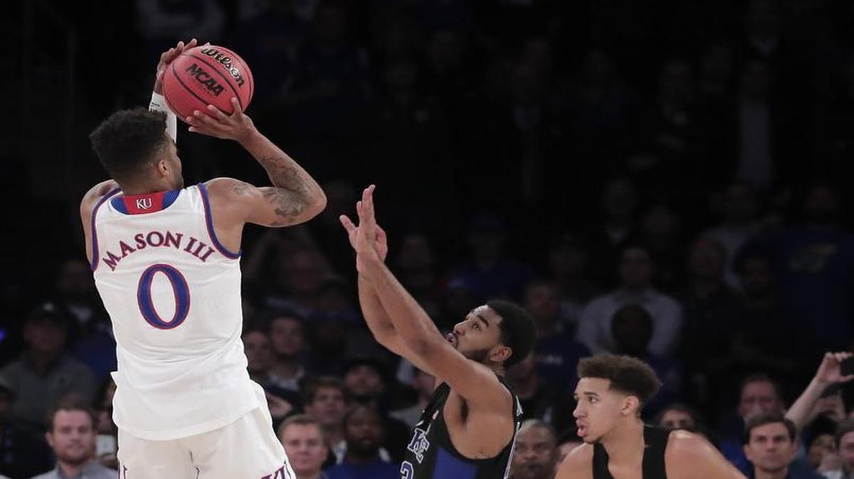 Kansas guard Frank Mason (left) has had a huge start to his senior season. He hit the game-winning shot against Duke on Tuesday in New York.