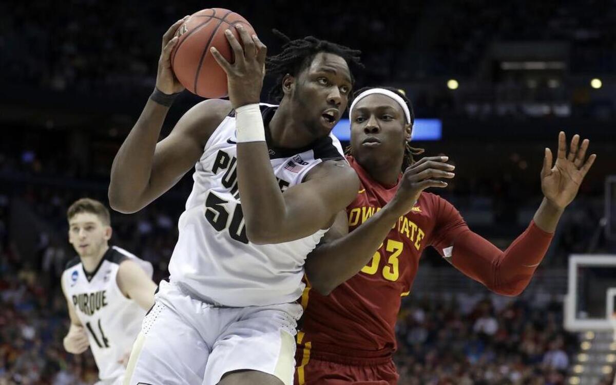 Purdue's Caleb Swanigan drives against Iowa State's Solomon Young during the first half of an NCAA college basketball tournament second-round game Saturday, March 18, 2017, in Milwaukee.