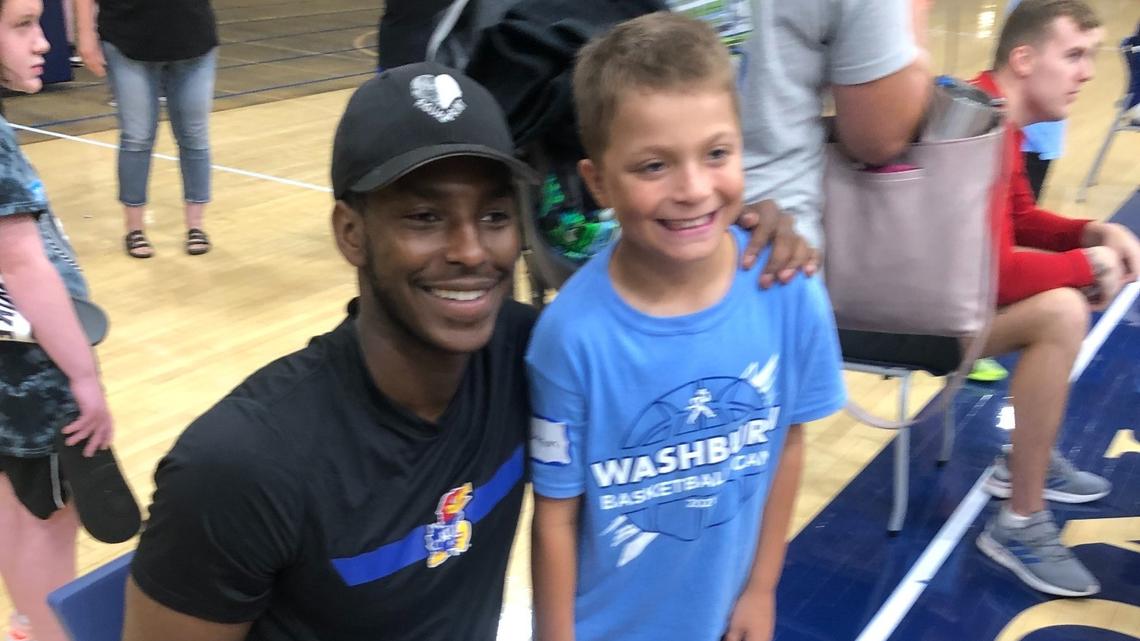 Kansas guard Jalen Coleman-Lands poses for a photo with a camper at Washburn basketball camp on Thursday, July 1, 2021 in Topeka.