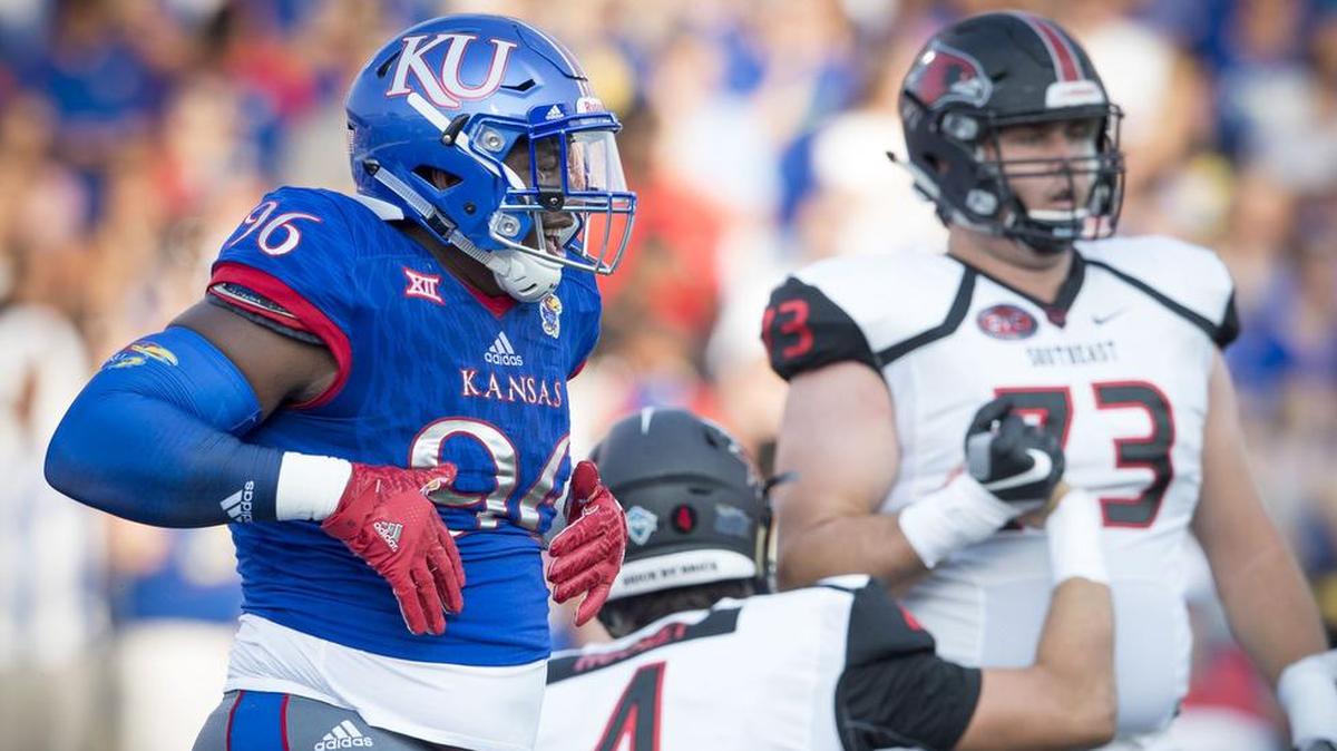 Kansas defensive lineman Daniel Wise (right) is coming back for his senior season with the Jayhawks.
