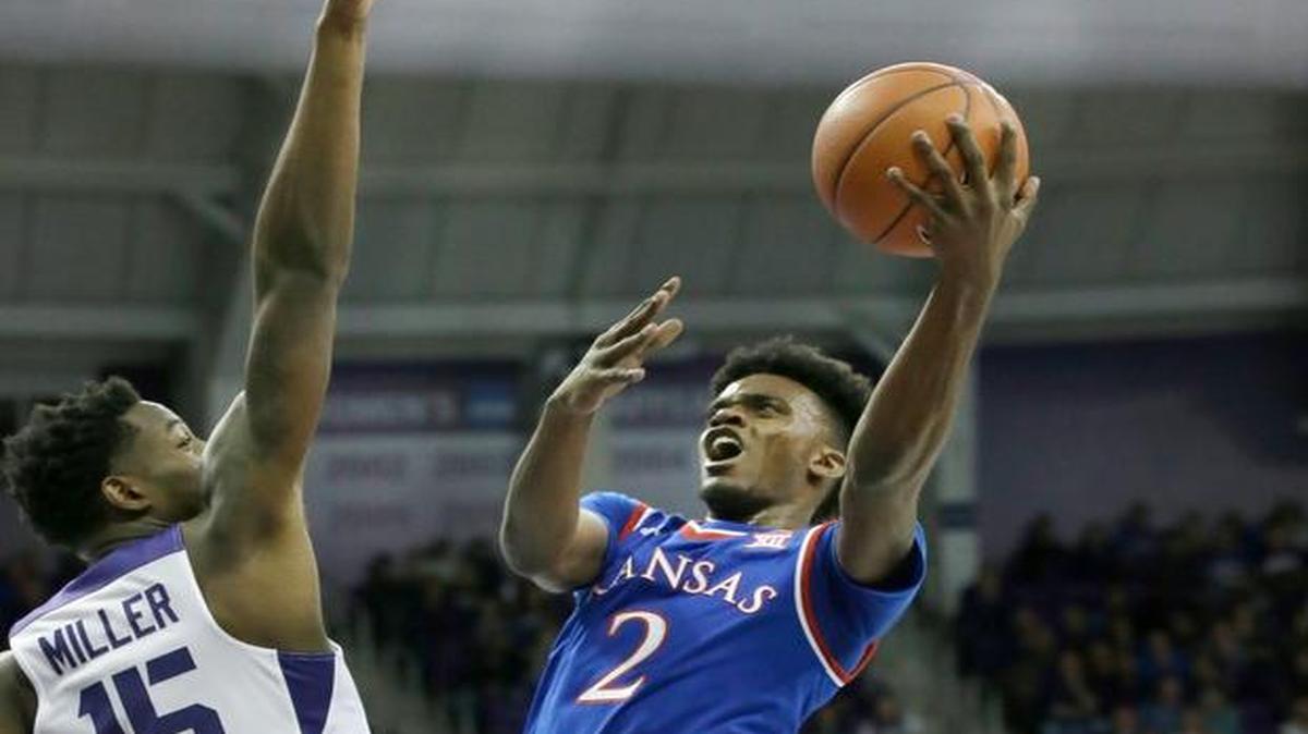 Kansas guard Lagerald Vick (2) shoots against TCU forward JD Miller (15) during the first half Friday in Fort Worth, Texas.
