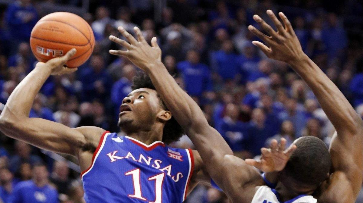 KU’s Josh Jackson (left) scored 20 points in the Jayhawks’ 79-73 win over Kentucky on Saturday.