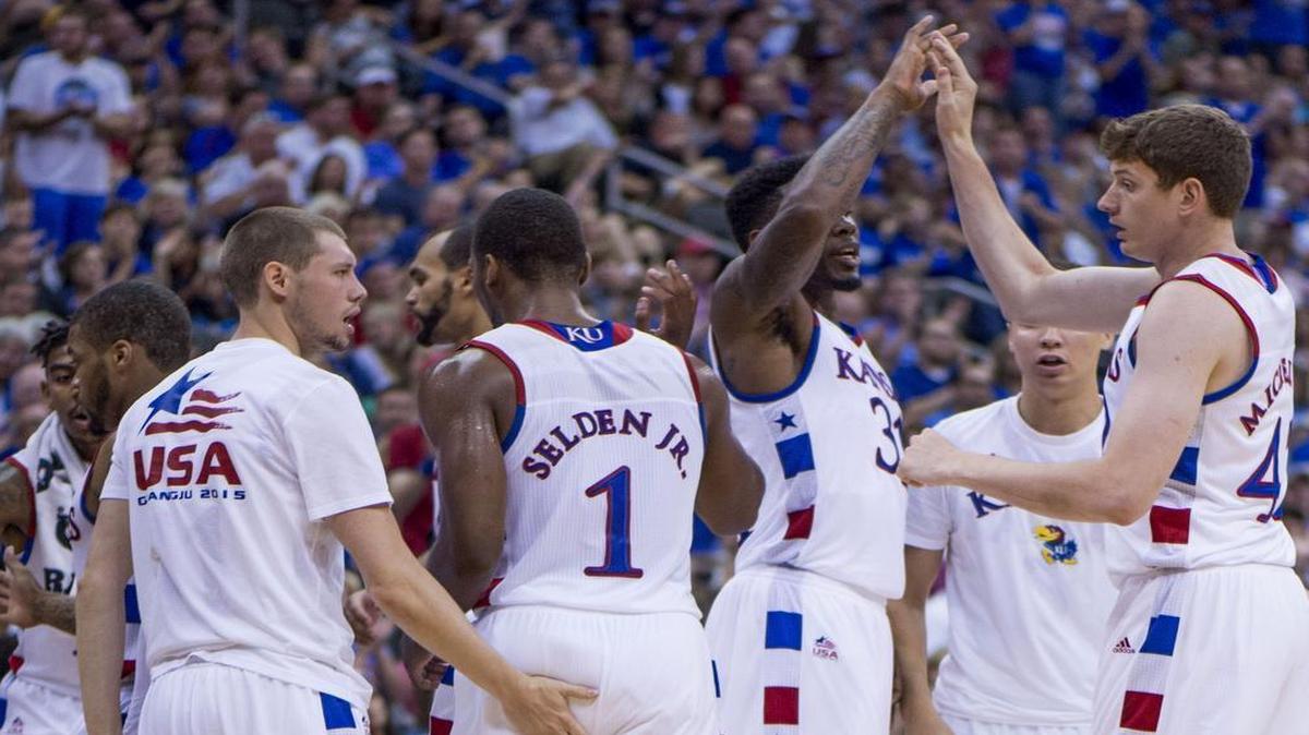 
In this June 26, 2015, file photo, KU forward Hunter Mickelson (42) was welcomed to the bench after scoring when the U.S. team composed mostly of Jayhawks beat Team Canada 87-76 at Sprint Center. 
