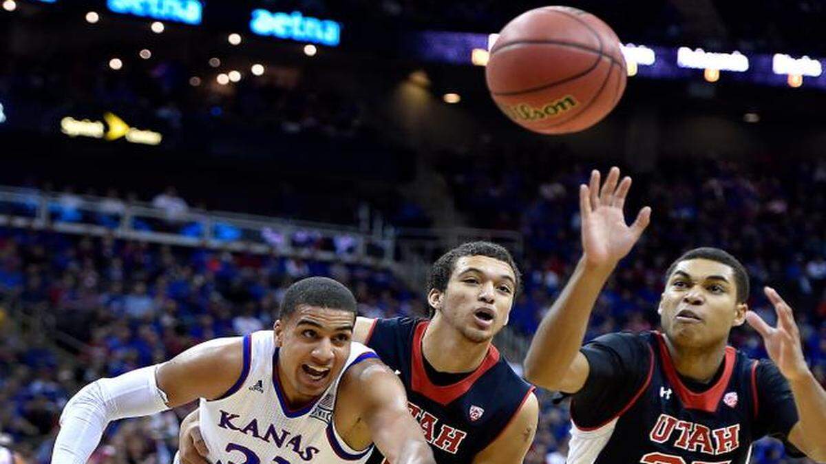 
Utah's Brekkott Chapman (middle) tried to keep Kansas’ Landen Lucas from the ball while the Utes’ Kenneth Ogbe ran down a long rebound in the first half Saturday at the Sprint Center. The No. 10 Jayhawks beat the No. 13 Utes 63-60 to improve to 8-1 this season.
