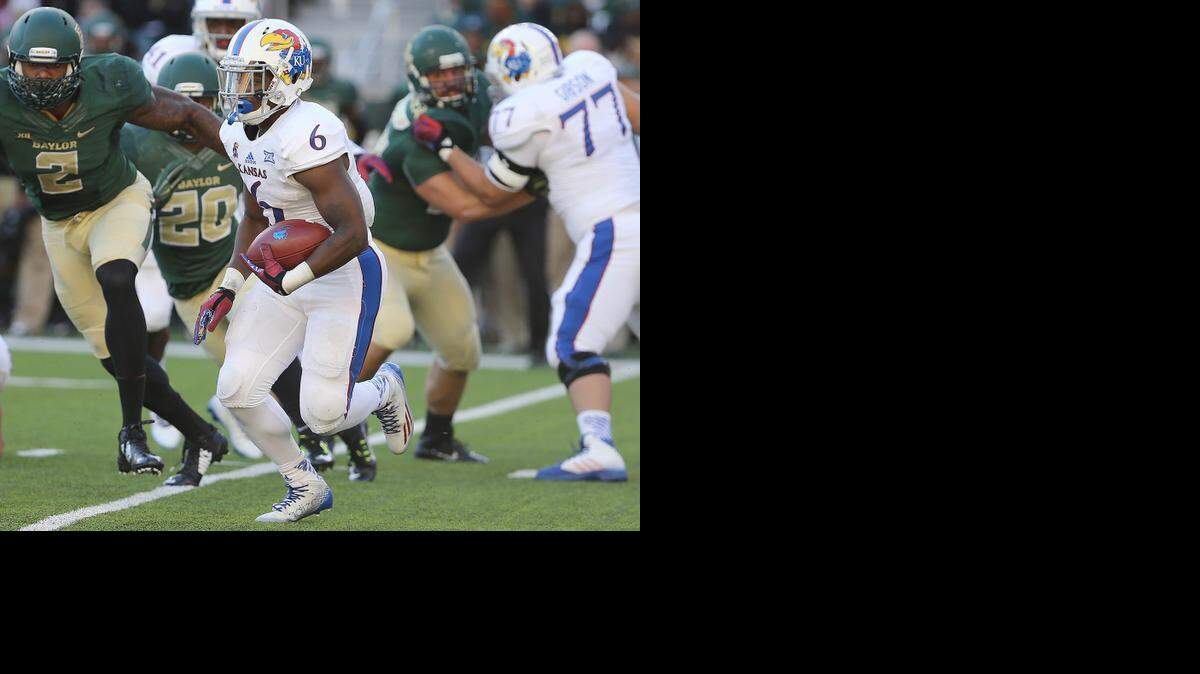 
Kansas running back Corey Avery (6) ran against the Baylor defense in the first half Saturday in Waco, Texas.
