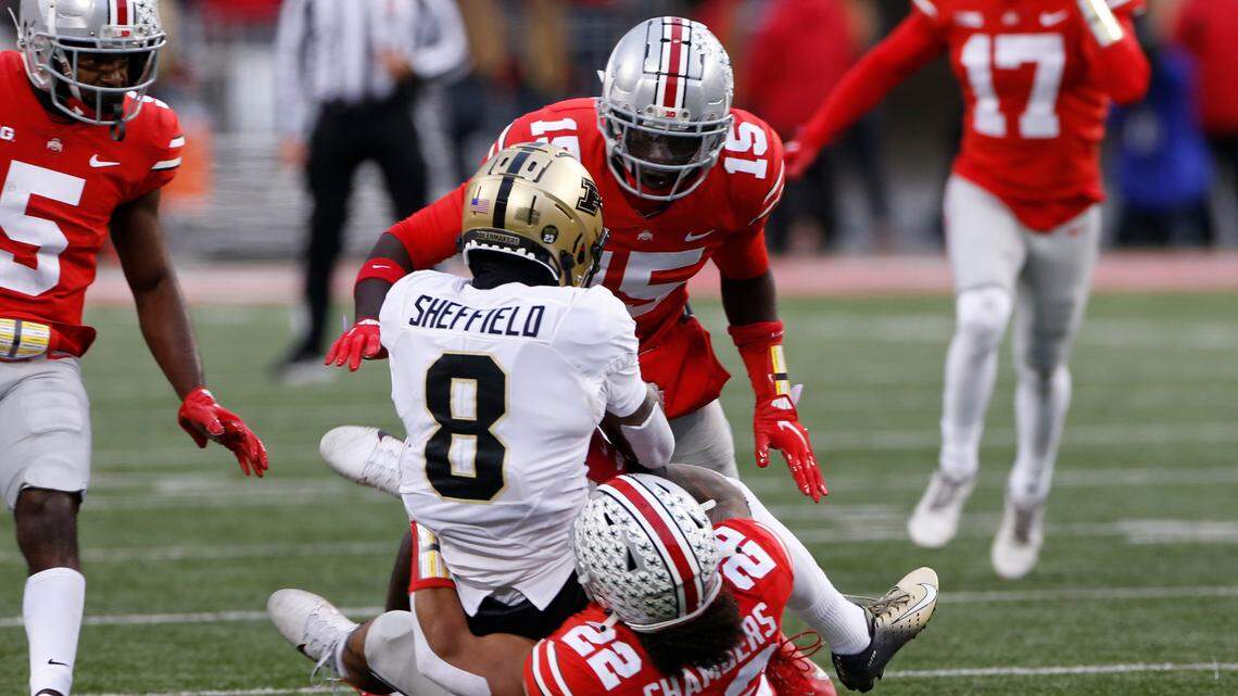 Ohio State linebacker Craig Young, top, and linebacker Steele Chambers, bottom, tackle Purdue receiver TJ Sheffield during the first half of a game, Saturday, Nov. 13, 2021, in Columbus, Ohio.