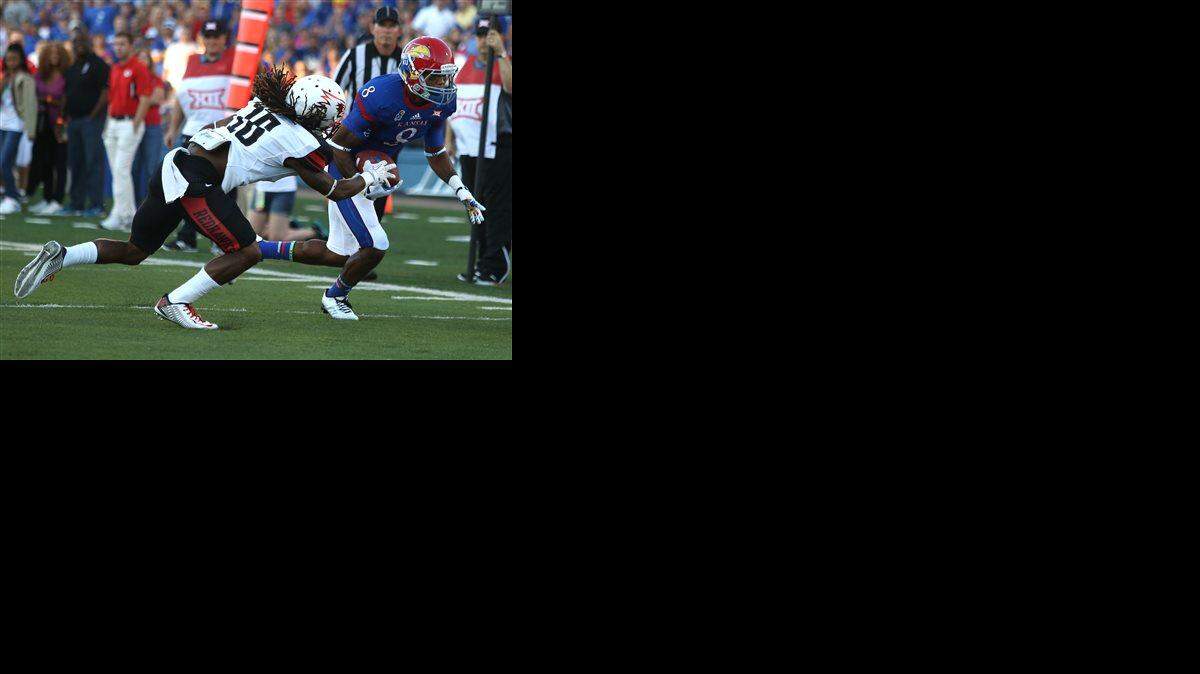
Kansas’ Nick Harwell (right) runs past Southeast Missouri State cornerback Justin Elias for a touchdown in the first quarter of the Sept. 6 game in Lawrence.
