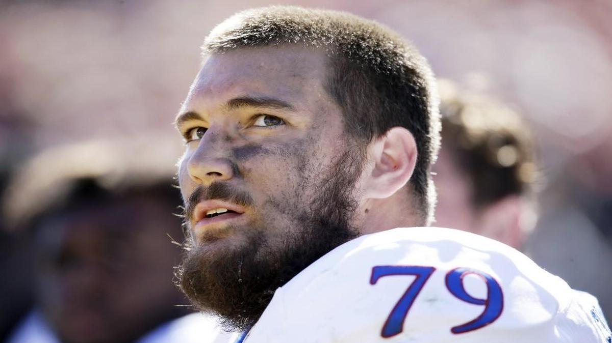 This Oct. 3, 2015 file photo shows Kansas offensive lineman Jordan Shelley-Smith on the bench during the second half of a game against Iowa State in Ames, Iowa.