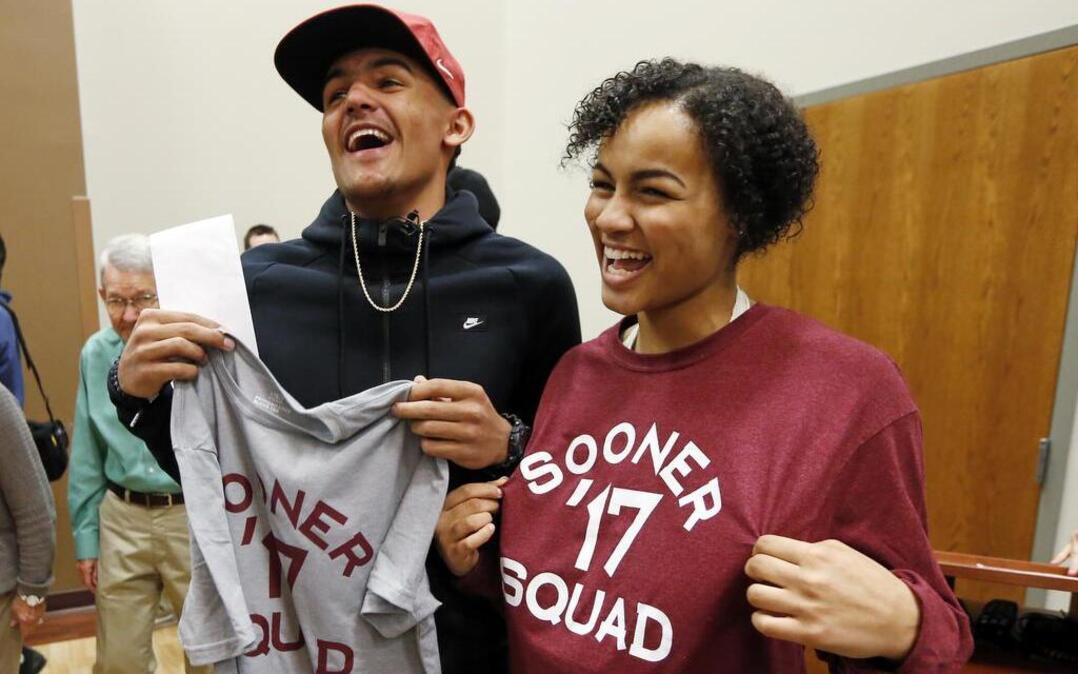 Norman North basketball star Trae Young (left) poses with fellow OU commit Ana Llanusa on Thursday in Norman, Okla. Young picked Oklahoma over Oklahoma State and Kansas.