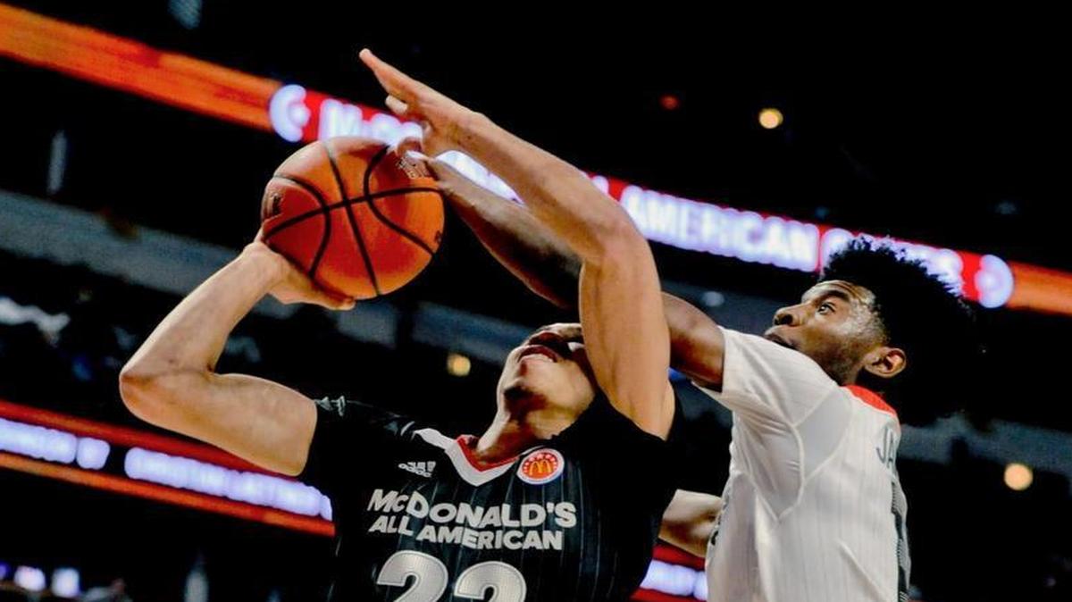 West forward Josh Jackson (right), who is being recruited by Kansas, blocked a shot by East forward Jayson Tatum of St. Louis during the McDonald's All-American boys basketball game Wednesday in Chicago. Jackson is rated No. 1 by Rivals.com and Tatum is third.