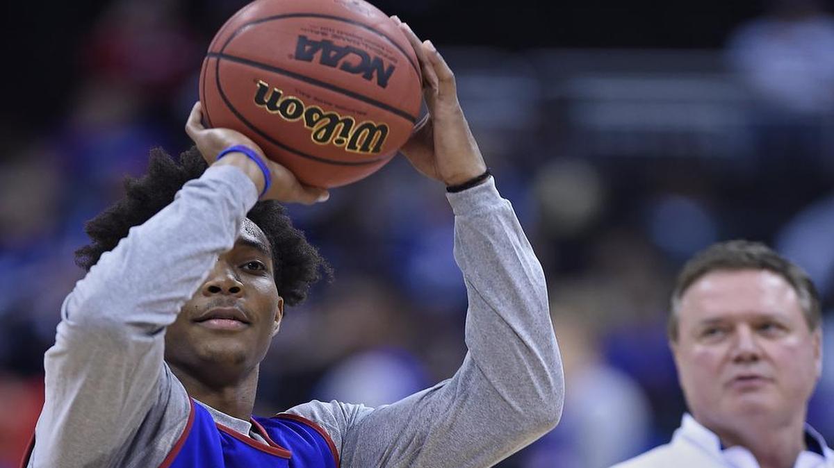 Kansas coach Bill Self (right) watched as the Devonté Graham took shots from beyond the arc during the team's practice at the Sprint Center prior to their Sweet 16 matchup against Purdue in the NCAA Tournament.
