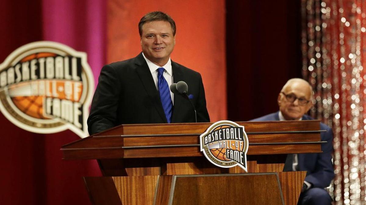 Kansas coach Bill Self spoke during his enshrinement into the Naismith Memorial Basketball Hall of Fame on Friday night as his presenter, former Kansas coach Larry Brown, listened to the speech.