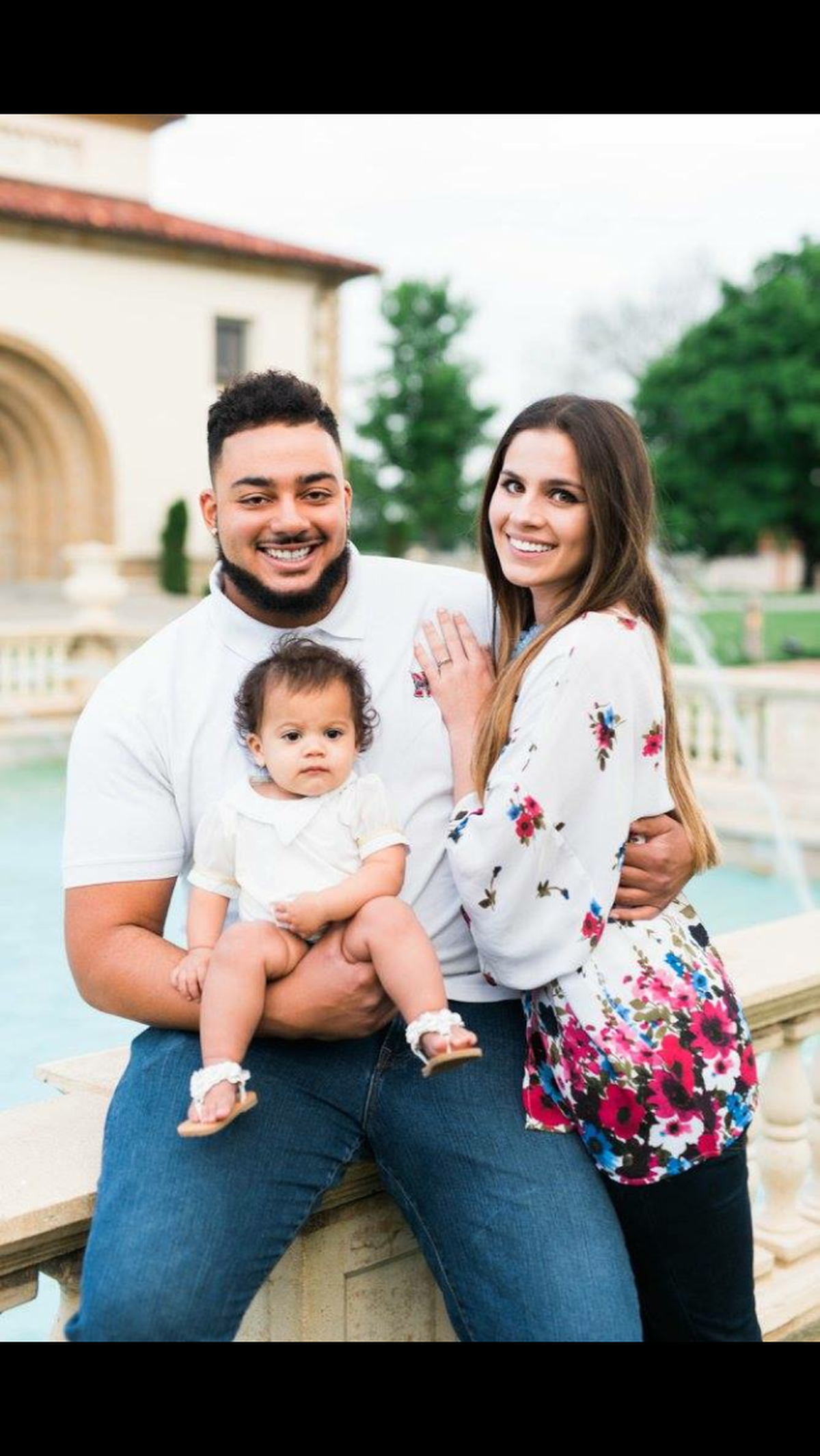 KU football player Zach Hannon with his wife, Jennifer, and daughter Harper.