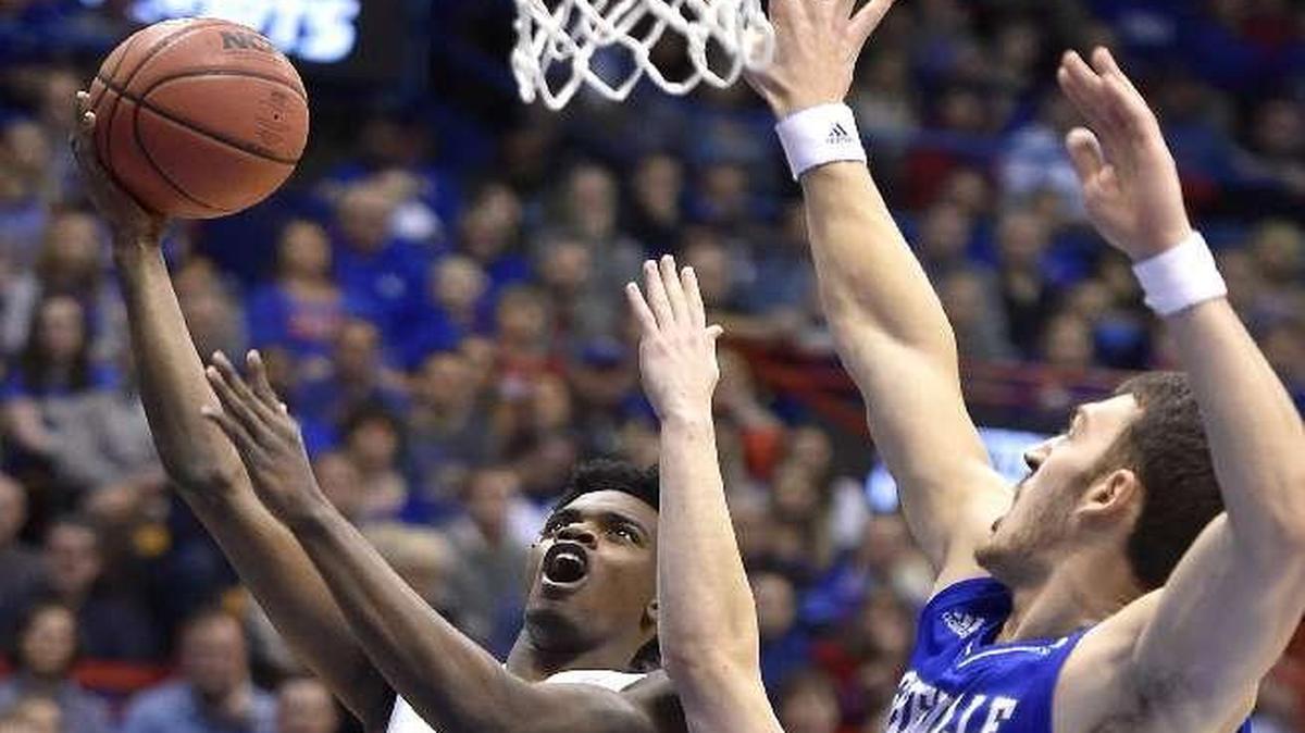 Lagerald Vick (left) started for KU against UNC Asheville on Friday and scored 15 points.