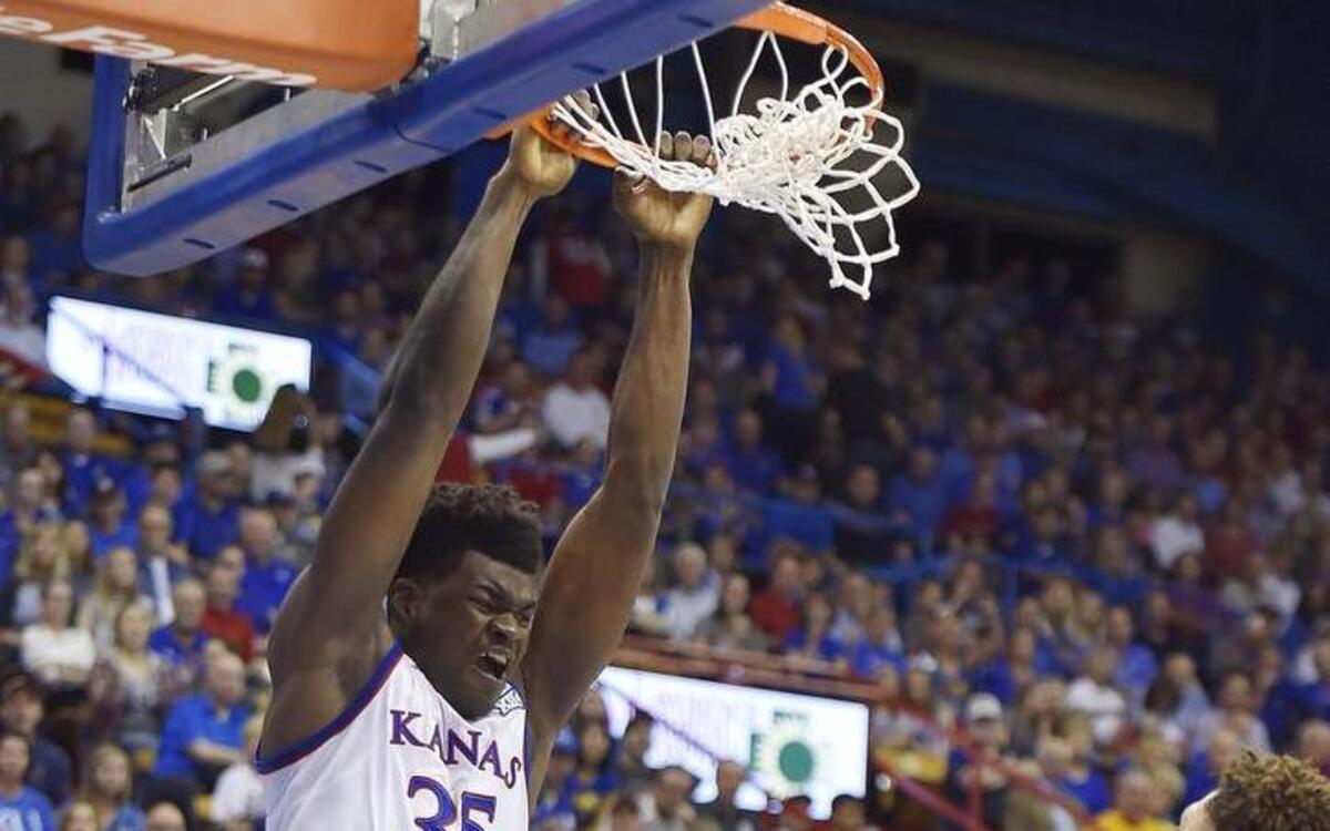Kansas freshman Udoka Azubuike (left) had a nice dunk in the first half on Tuesday night against Washburn, but he also played his way into early foul trouble against the Ichabods.