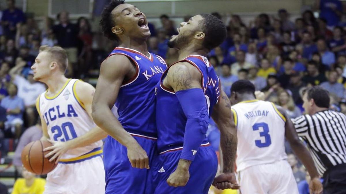 Kansas’ Devonte’ Graham (left) and Frank Mason celebrated during a win over UCLA last month. The duo faces Harvard today.