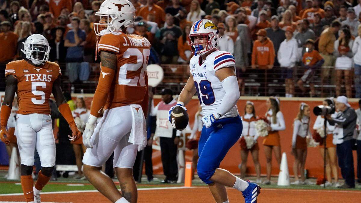 Kansas tight end Mason Fairchild (right) celebrates his touchdown catch against Texas during the first half in Austin, Texas, Saturday, Nov. 13, 2021.