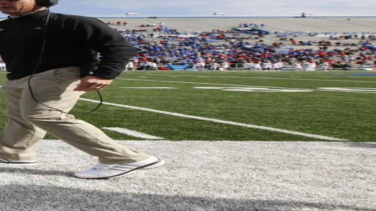 Kansas head coach David Beaty (right) and quarterback Ryan Willis knew the team’s defense stepped up last Saturday against Texas Tech.
