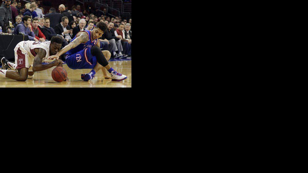 
 Kansas' Kelly Oubre Jr. (right), battling Temple's Quenton DeCosey for a loose ball ,was in the starting lineup Monday for Kansas.


