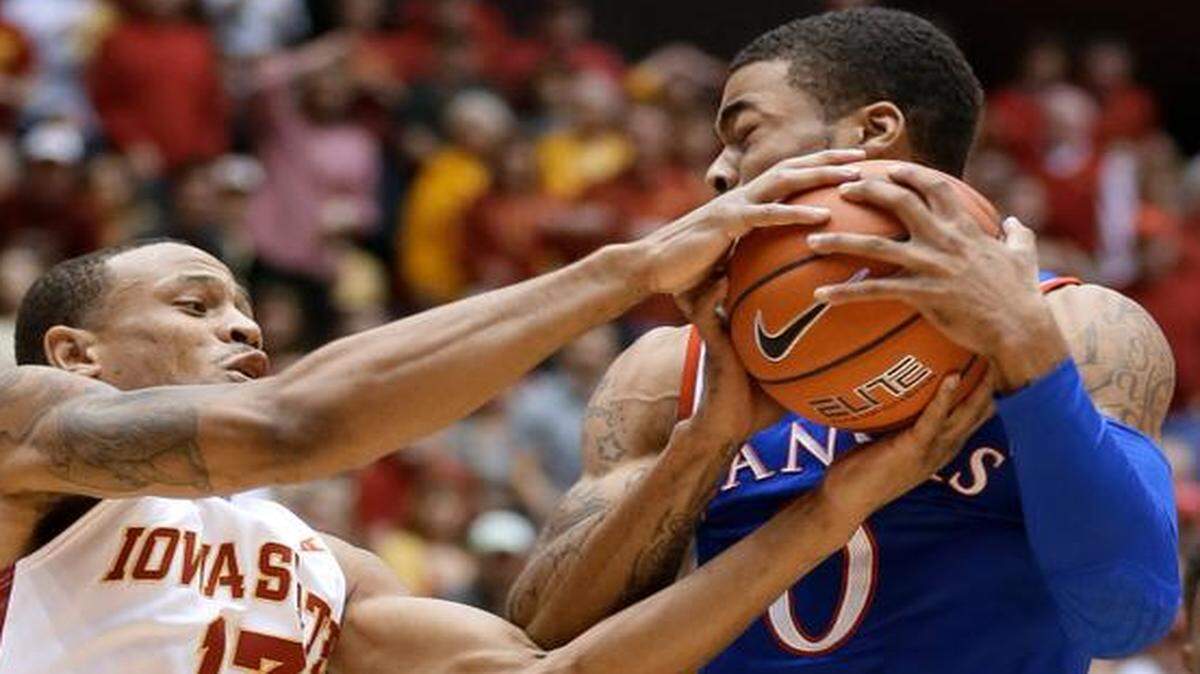 
Iowa State guard Bryce Dejean-Jones (left) fought for a rebound with Kansas guard Frank Mason III in the first half on Saturday night at Hilton Colesium in Ames, Iowa.
