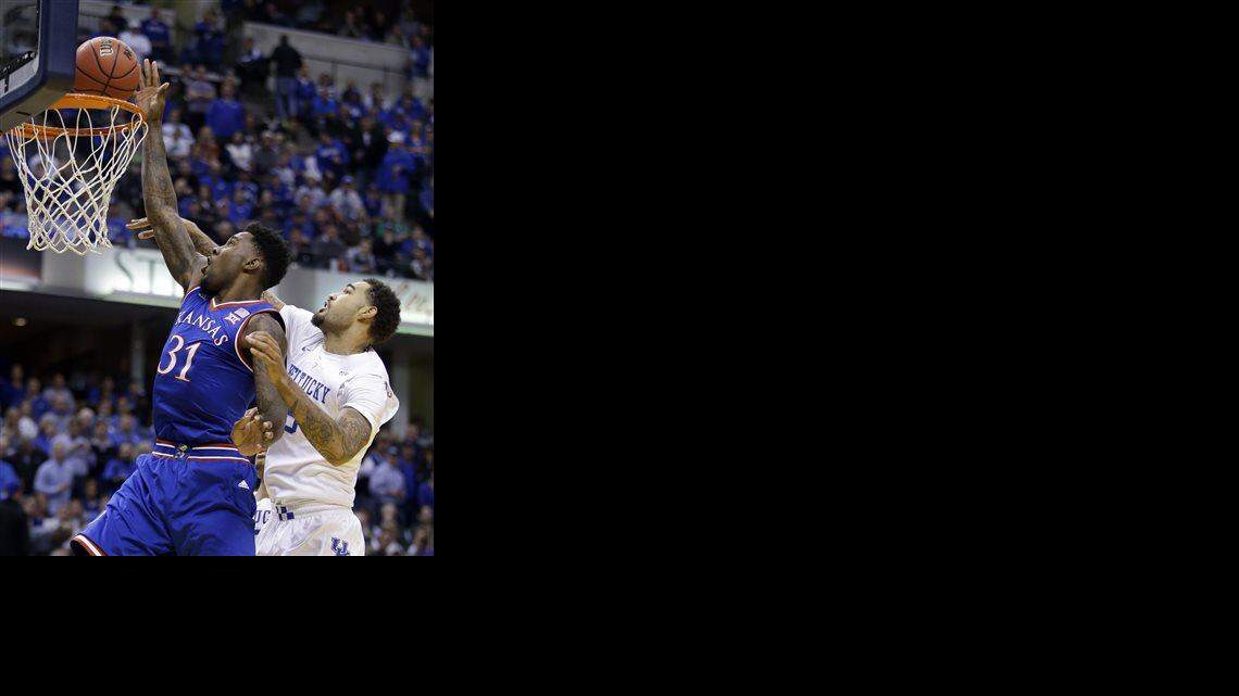 
Kansas's Jamari Traylor (31) puts up a shot against Kentucky's Willie Cauley-Stein (15) during the first half of an NCAA college basketball game Tuesday, Nov. 18, 2014, in Indianapolis. (AP Photo/Darron Cummings)
